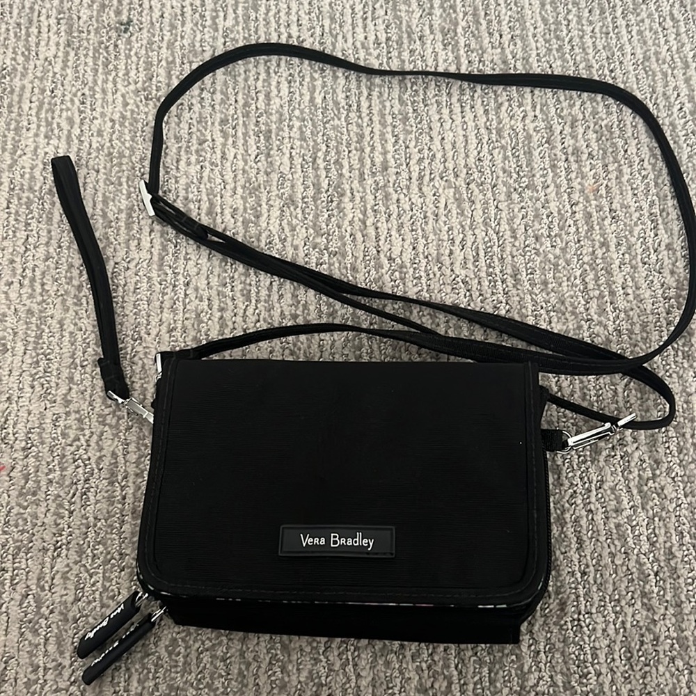Vet Bradley crossbody/wristlet bag with three separate sections.